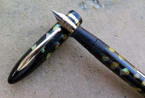 EARLY LEVER FILLING SHEAFFER BALANCE IN EBONIZED PEARL. Not oversized but it's not slim, either. 5 1/4" long. Fine 14K two tone nib